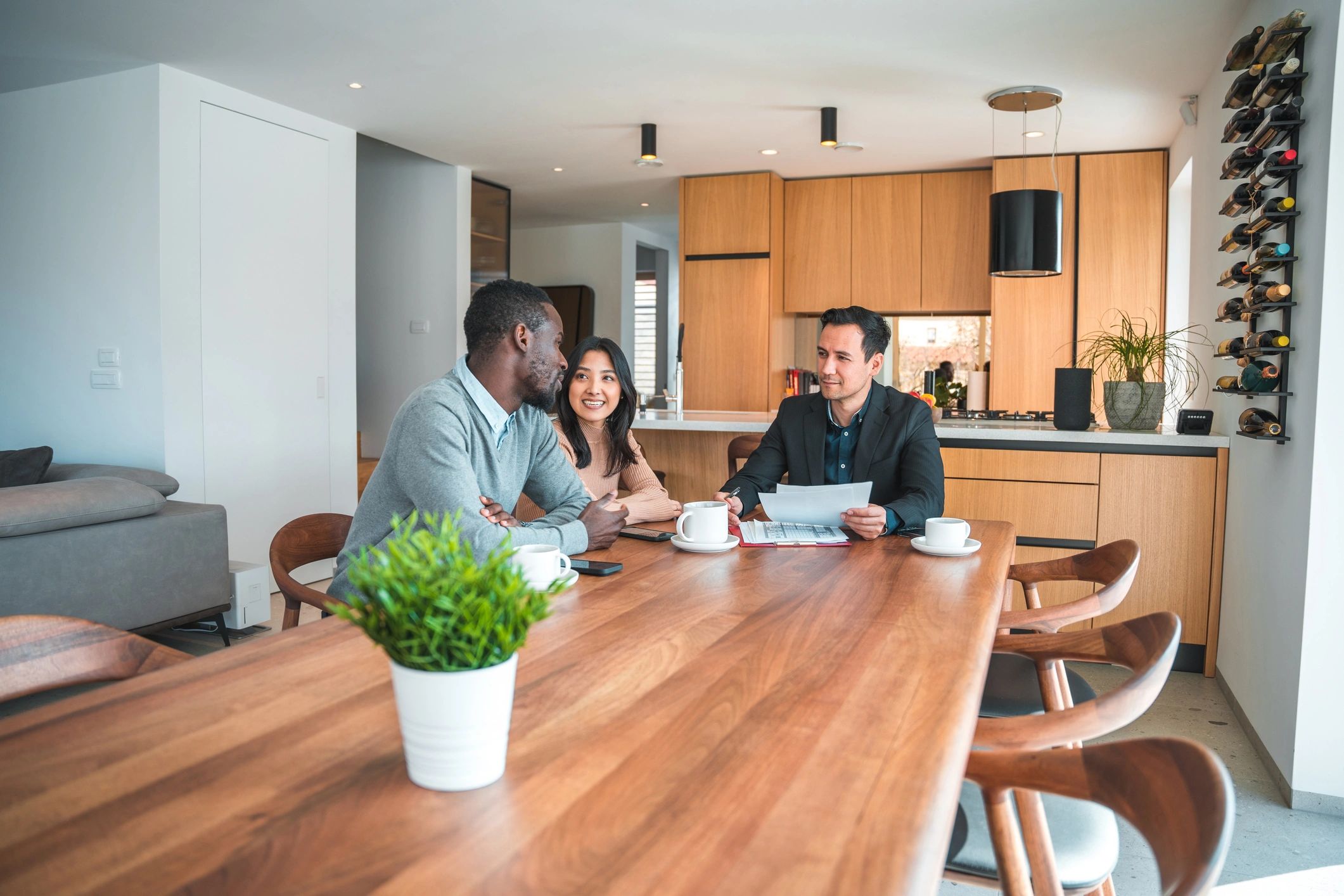 Happy home buyers with agent